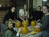 people carving pumpkins
