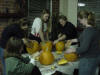 people carving pumpkins